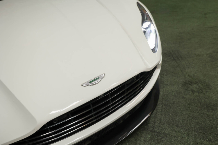 Aston Martin badge and front grille on white DB11 V12