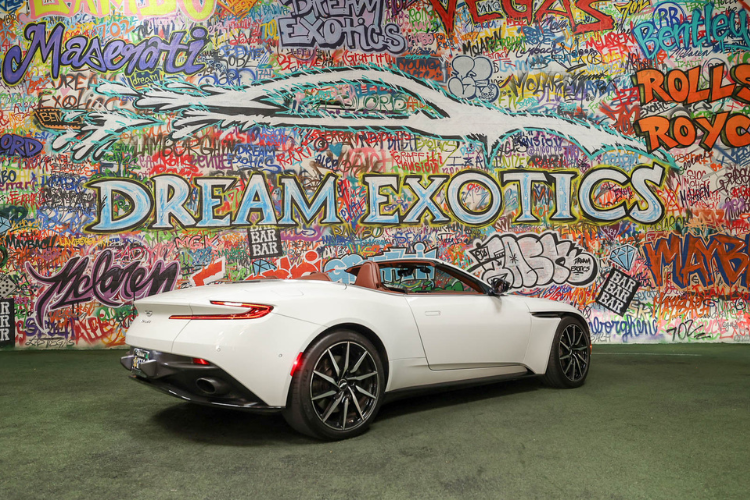 Rear three-quarter view of white Aston Martin DB11 V12