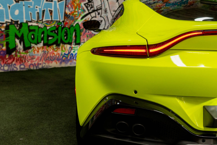 Neon green Aston Martin Vantage luxury sports car rental in Los Angeles from Dream Exotics.