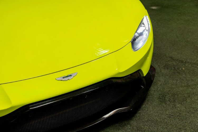 Neon green Aston Martin Vantage luxury sports car rental in Los Angeles from Dream Exotics.