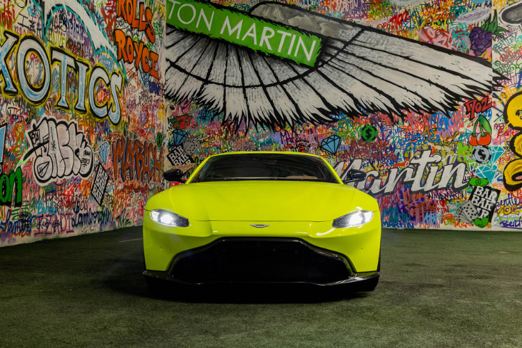 Neon green Aston Martin Vantage luxury sports car rental in Los Angeles from Dream Exotics.