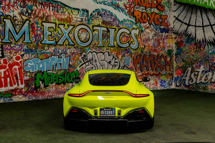 Neon green Aston Martin Vantage luxury sports car rental in Los Angeles from Dream Exotics.