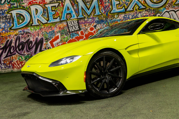 Neon green Aston Martin Vantage luxury sports car rental in Los Angeles from Dream Exotics.