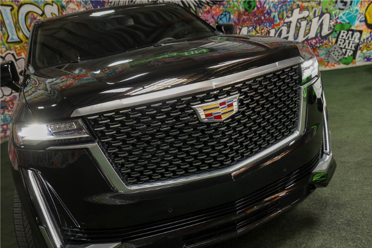 Close-up of black Cadillac Escalade ESV front grille
