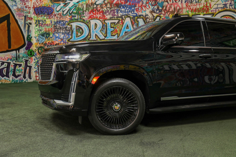 Close-up side view of black Cadillac Escalade ESV