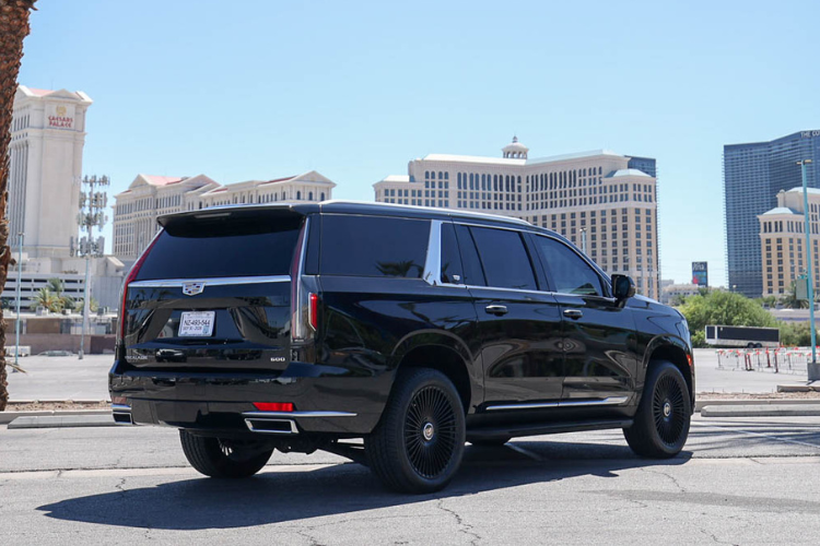 Rear side view of black Cadillac Escalade ESV on the Las Vegas Strip