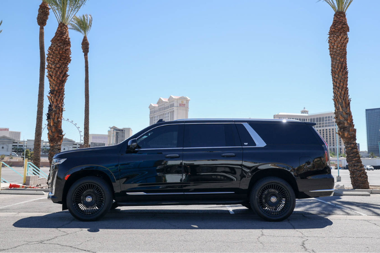 Side profile of black Cadillac Escalade ESV near the Las Vegas Strip