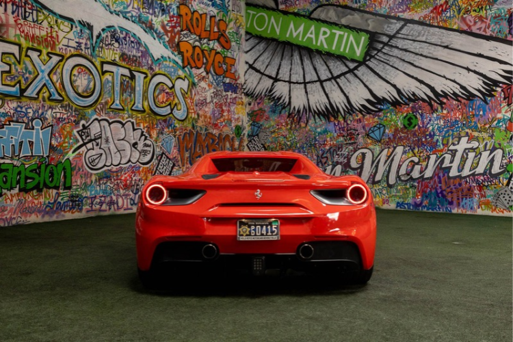 Rear view of red Ferrari 488 Spider rental at Dream Exotics