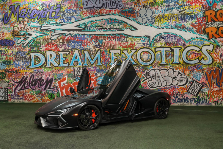 Black Lamborghini Revuelto with scissor doors open at Dream Exotics