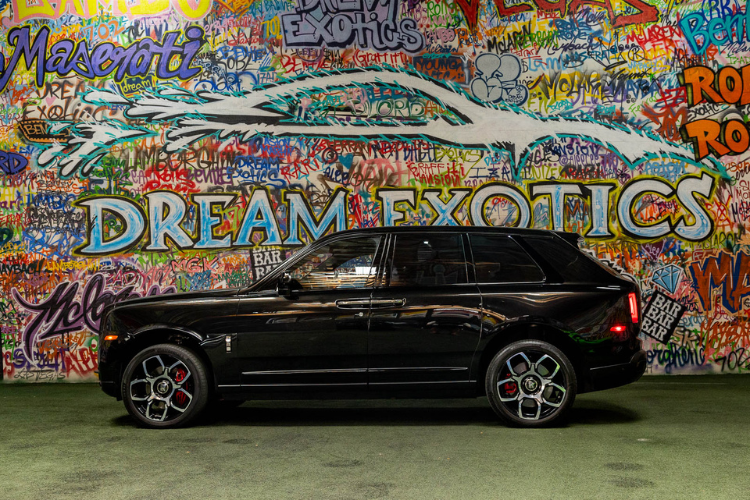 Close rear-side view of a black Rolls-Royce Cullinan luxury SUV