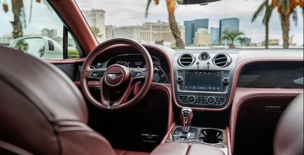Dark red interior of a Bentley car rental near the Las Vegas Strip.