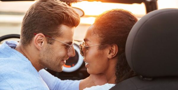 Couple Kissing In Exotic Convertible