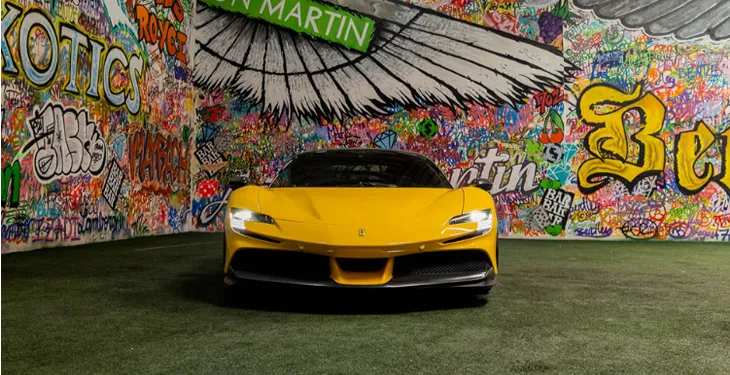 Front view of a yellow Ferrari SF90 Stradale Supercar Rental available In LA.