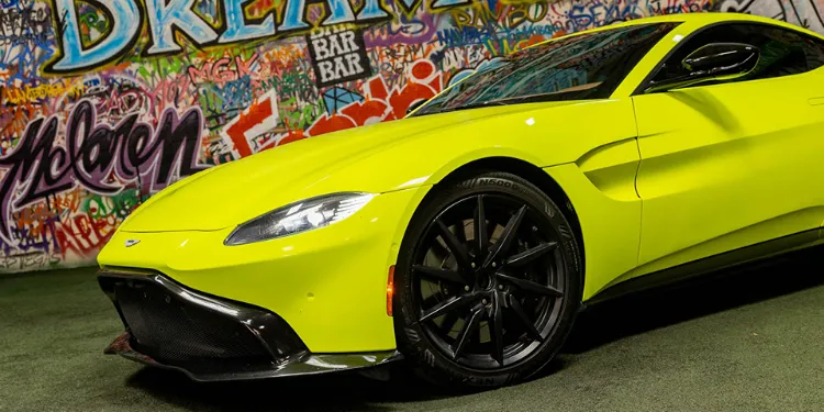 Neon green Aston Martin Vantage rental in Los Angeles.
