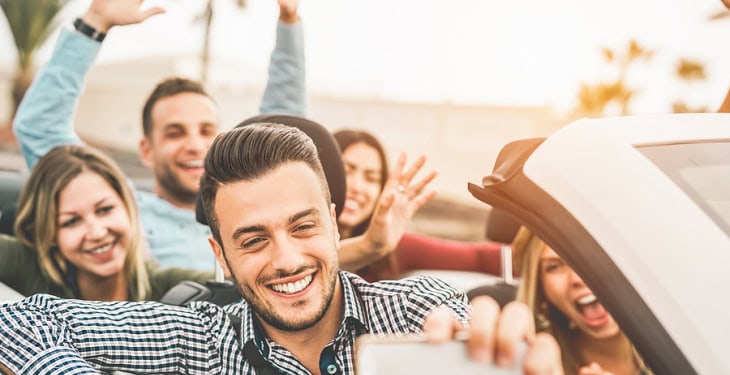 Happy group enjoying an exotic car rental in Las Vegas.